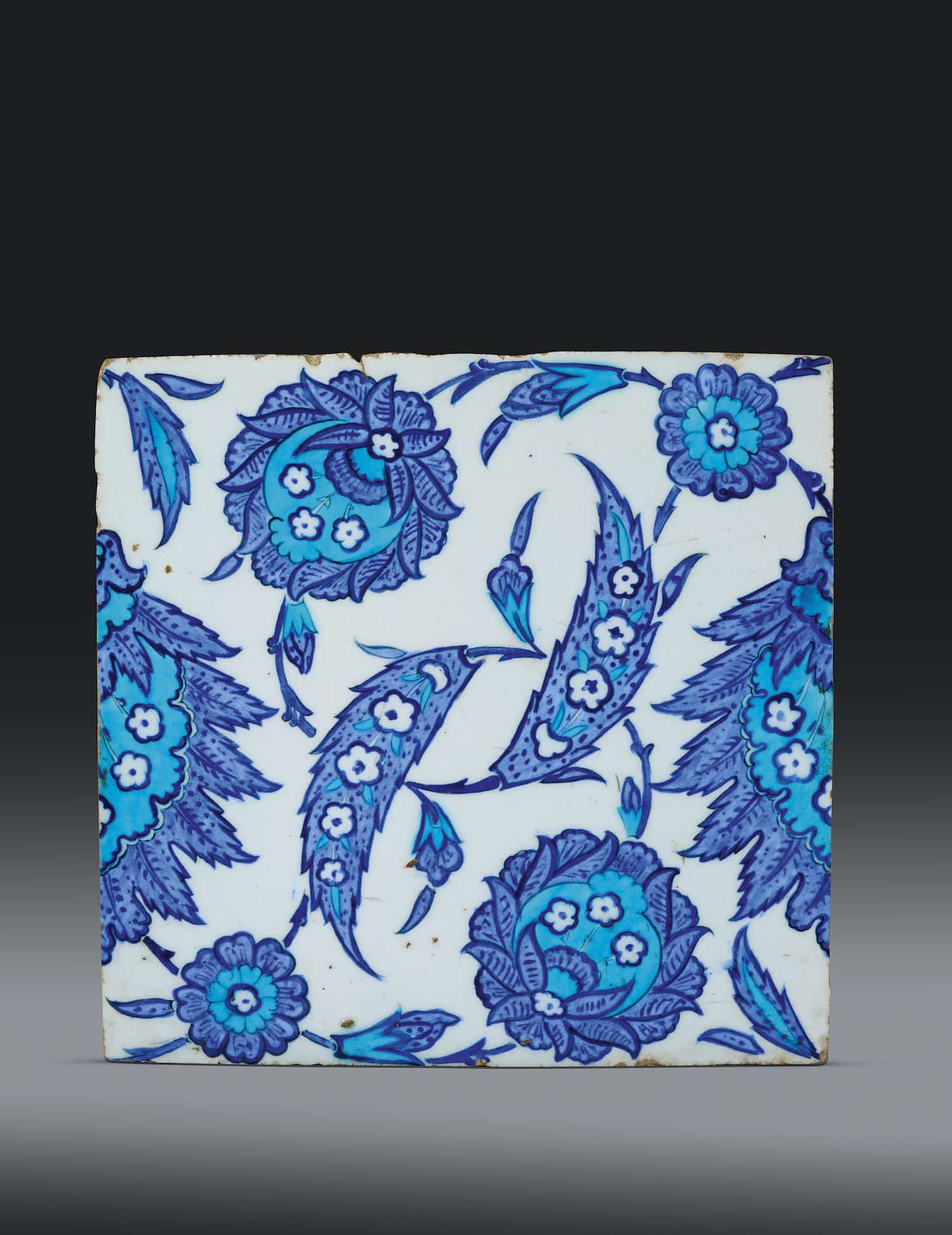 Iznik blue and white tile with saz leaves and khatai blossoms