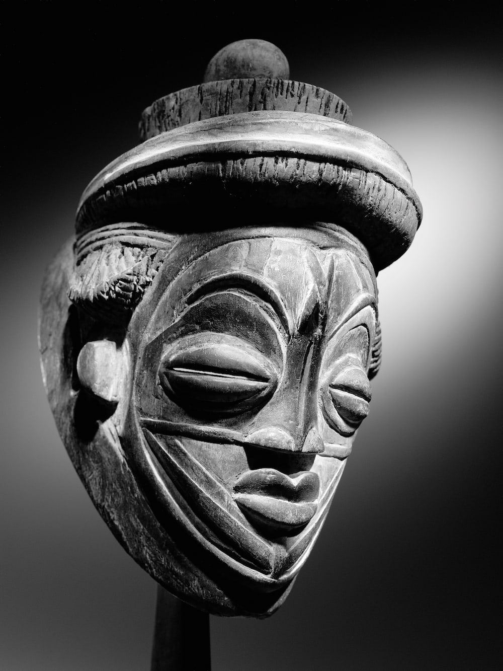 Tsangui white mask called Duma or Mvudi Tsangui - Punu/Lumbu, southern Gabon and Congo. Cheese wood, hair, natural pigments. 